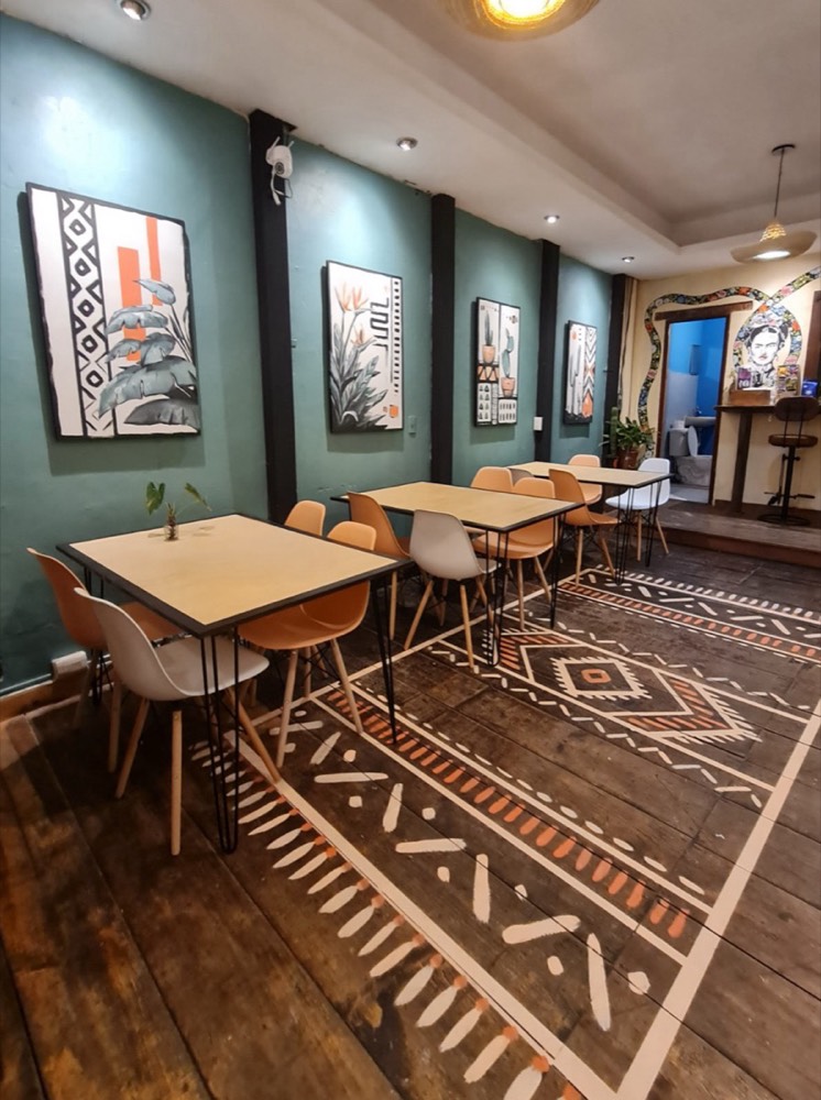 A space with works and a painted floor by Maayan Kalo